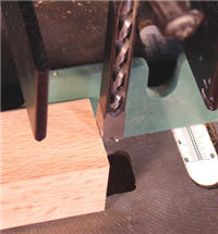 mortiser11 Orient the hollow chisel on a mortising machine