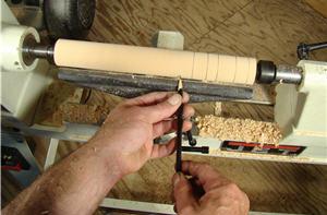 turning13 Make a series of pencil lines on the cylinder, indicating where you’ll cut coves.