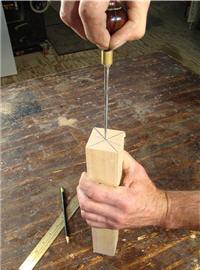 turning4 Dimple the center point of a spindle blank using a scratch awl.