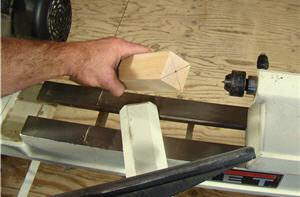 turning6 Engage the live center in the dimple you made in the tailstock end of the spindle blank.